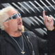 guy fieri pointing to the sky